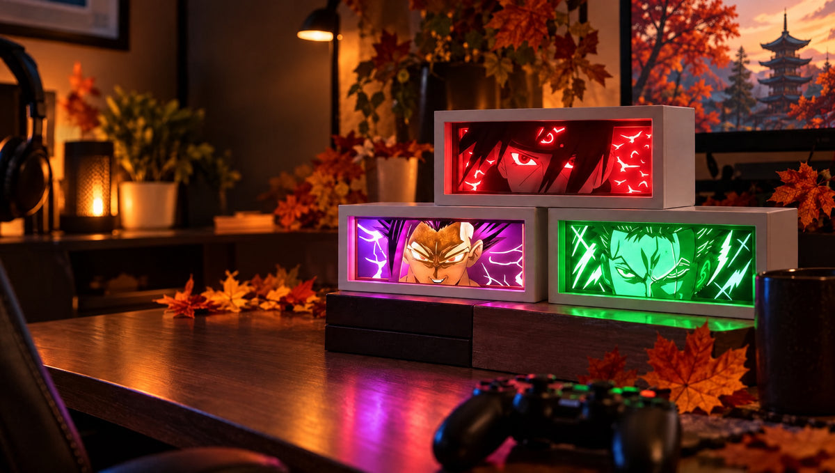 Three anime LED light boxes (Sasuke, Gohan Beast, Zoro) glowing on a wooden desk at night with a game controller